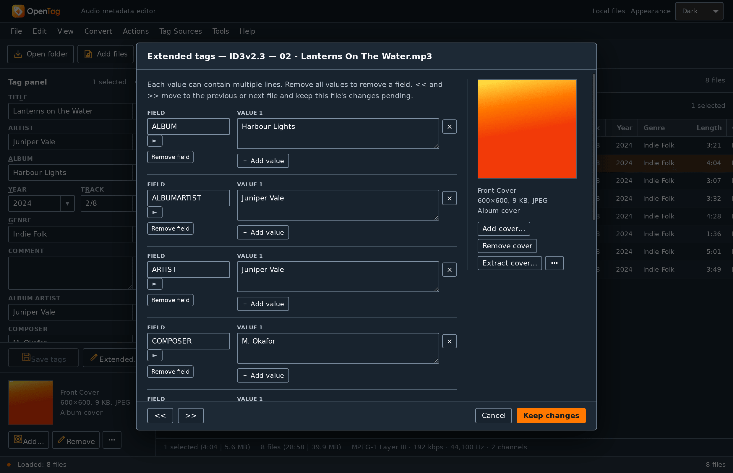 The Extended tags dialog for one file: a list of field names with their values, and the cover art on the right